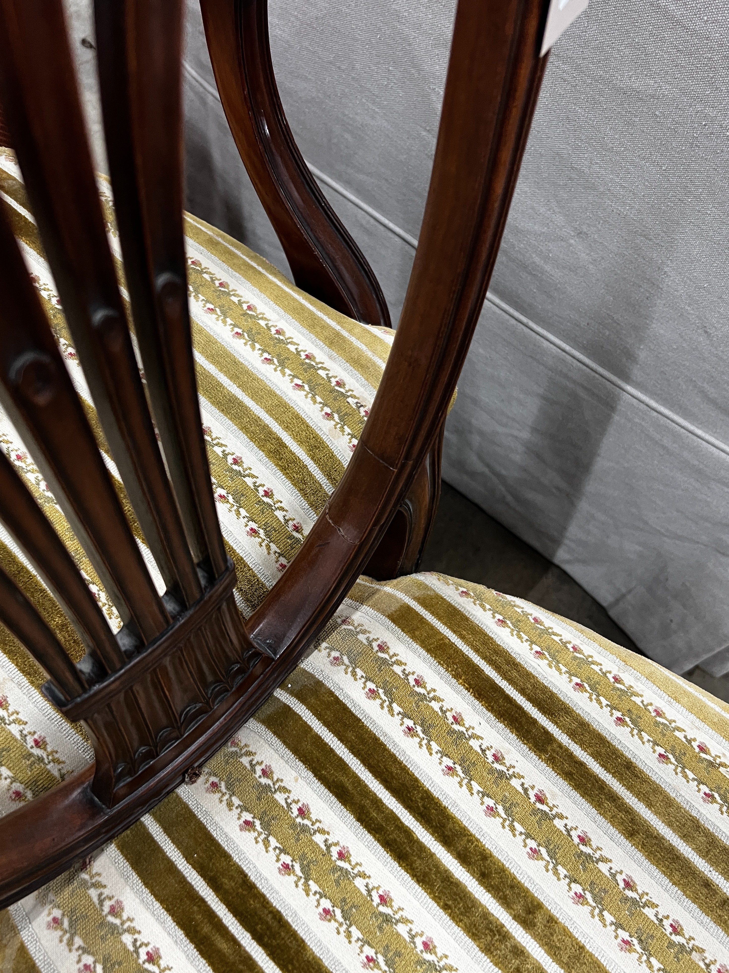 A set of eight early 20th century mahogany Hepplewhite style shield back dining chairs, two with arms